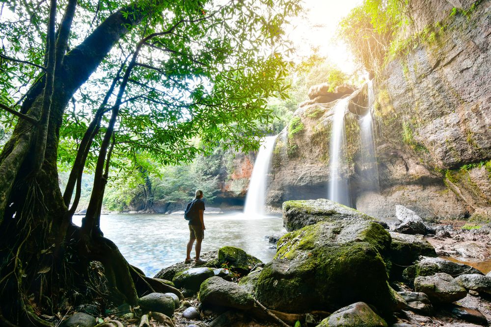 Man in Haew Suwat Waterfall at Khao Yai National