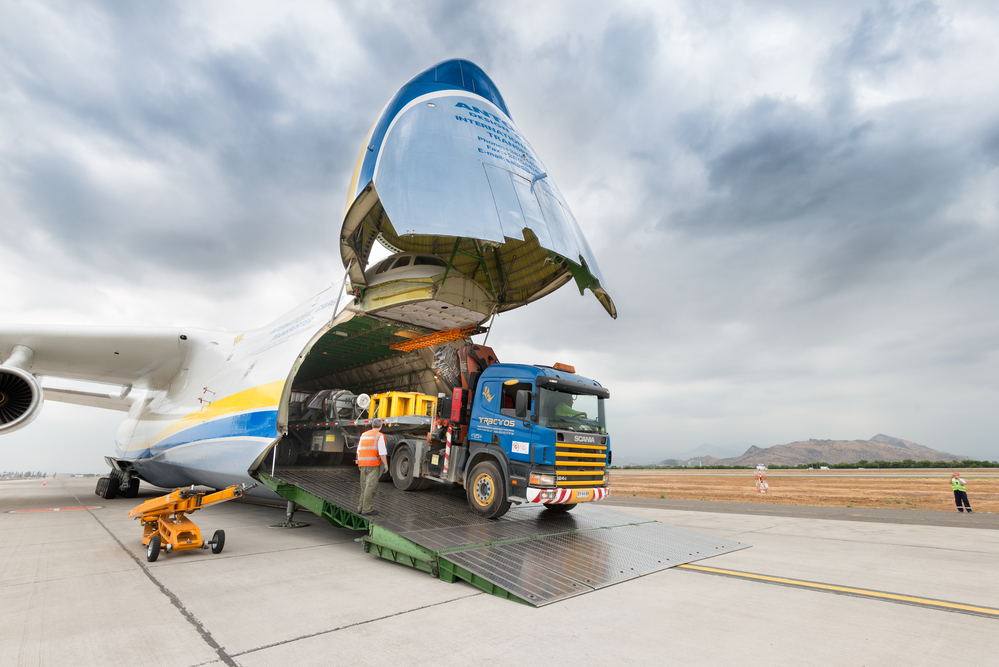Santiago de Chile, Metropolitan Region, Chile, South America - November 23, 2016: A big truck with cargo going inside The Antonov 225 also know as AN-225 and the biggest airplane in the world, landed in the tarmac of Santiago international airport for transporting a big heavy cargo.